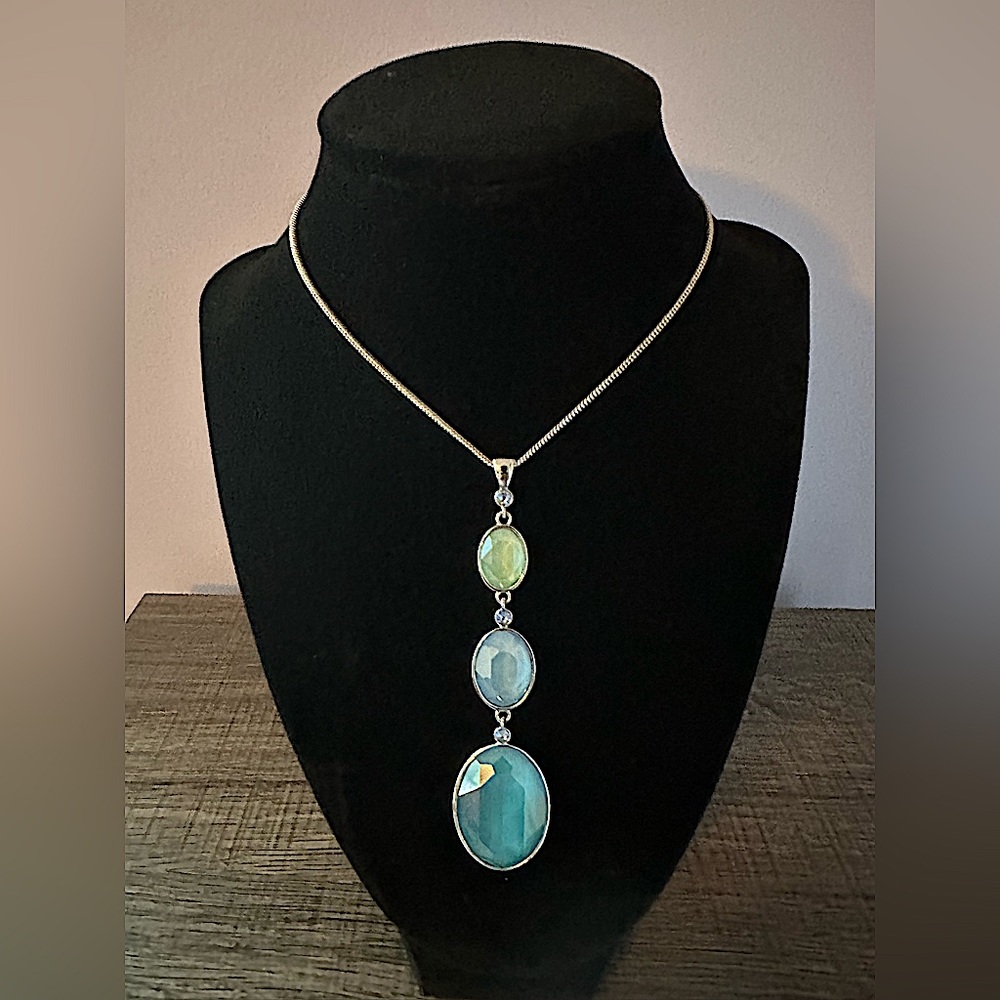 Touchstone Crystal three oval pendant necklace with adjustable length sizing.
